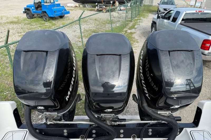 Slide: The Image of Three Mercury outboard engines on a 2005 Fountain 34 Sportfish CC Open Bow boat. - 35