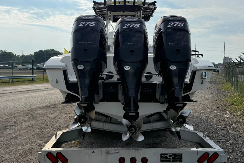 Slide: The Image of 2005 Fountain 34 Sportfish CC Open Bow with triple 275 horsepower engines on trailer. - 36
