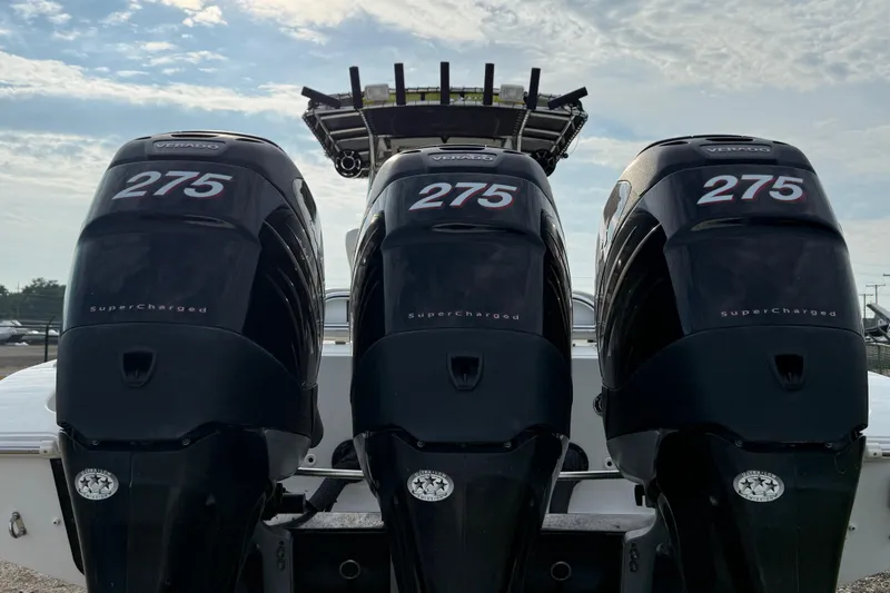 Slide: The Image of Triple Mercury Verado 275 outboard engines on a 2005 Fountain 34 Sportfish CC Open Bow. - 37
