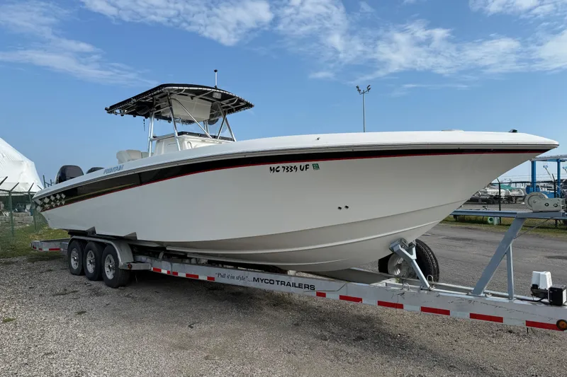 Slide: The Image of 2005 Fountain 34 Sportfish CC Open Bow on trailer, parked outdoors under blue sky. - 40