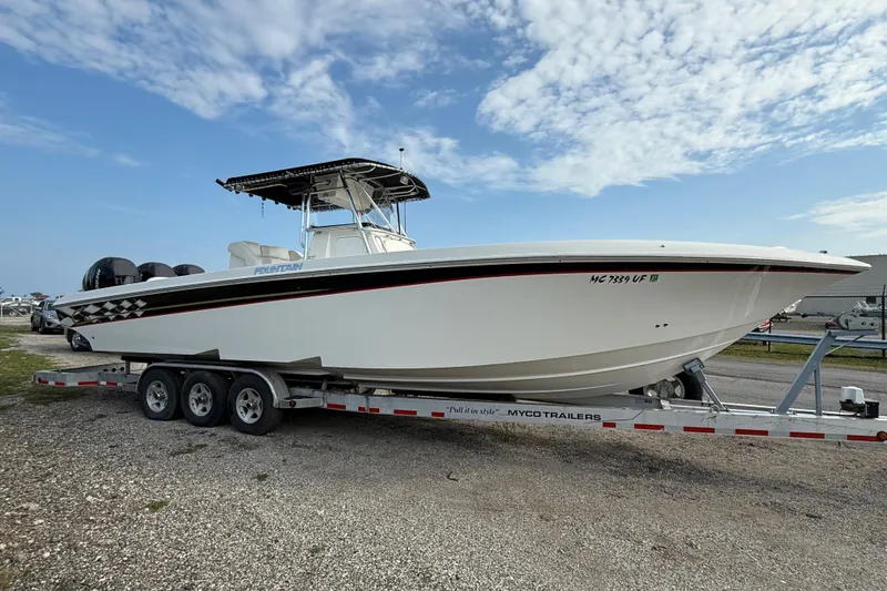 Slide: The Image of 2005 Fountain 34 Sportfish CC Open Bow on trailer under blue sky. - 41