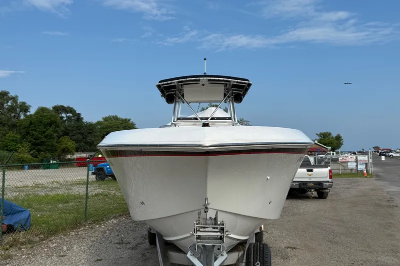 Slide: The Image of 2005 Fountain 34 Sportfish CC Open Bow boat on trailer, parked outdoors. - 42