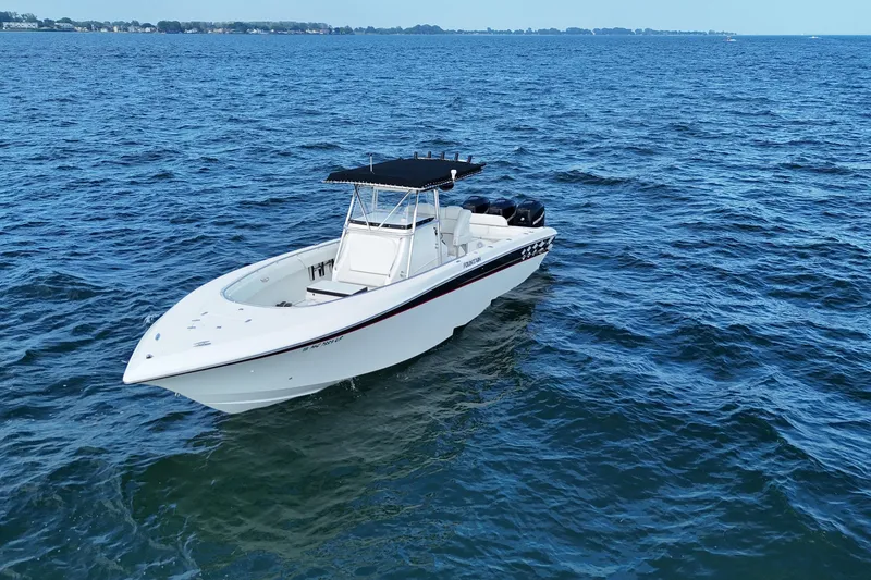 Slide: The Image of 2005 Fountain 34 Sportfish CC Open Bow boat on open water. - 6