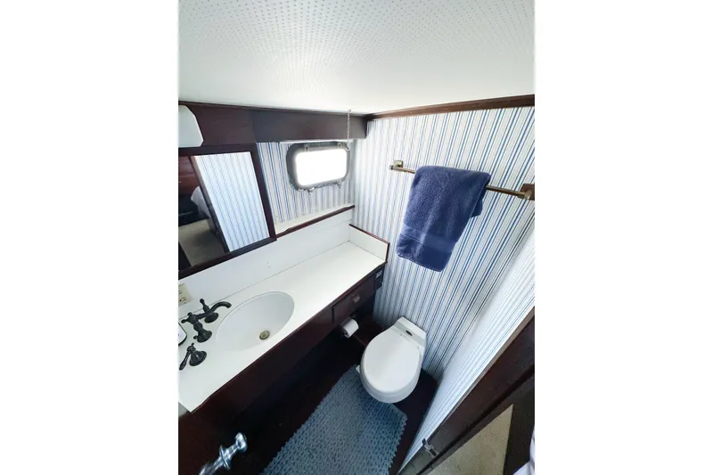 Slide: The Image of Bathroom interior of 1969 Stephens Brothers flush deck motor yacht, featuring sink and toilet. - 14