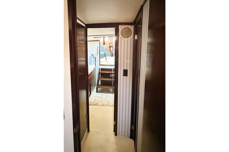 Slide: The Image of Hallway inside 1969 Stephens Brothers flush deck motor yacht, featuring wood paneling and cozy interior. - 16