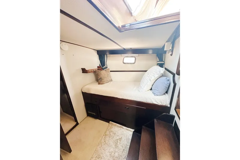 Slide: The Image of Cozy cabin interior of 1969 Stephens Brothers flush deck motor yacht with plush bedding. - 17