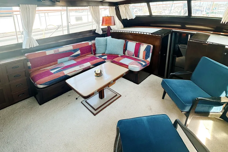 Slide: The Image of Interior of 1969 Stephens Brothers flush deck motor yacht with colorful seating and wooden accents. - 20