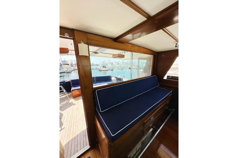 Slide: The Image of Interior of 1969 Stephens Brothers flush deck motor yacht with blue cushioned seating. - 22