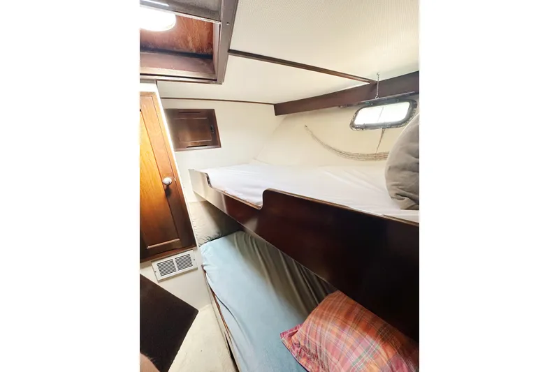 Slide: The Image of Interior of 1969 Stephens Brothers flush deck motor yacht with bunk beds and wooden cabinetry. - 24
