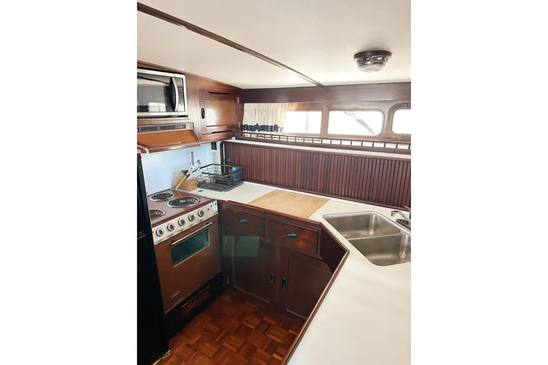 Slide: The Image of Interior of 1969 Stephens Brothers flush deck motor yacht kitchen with stove and sink. - 35
