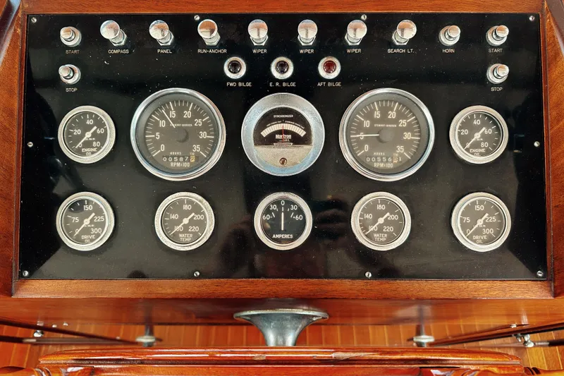 Slide: The Image of Instrument panel of a 1969 Stephens Brothers flush deck motor yacht with gauges and controls. - 37