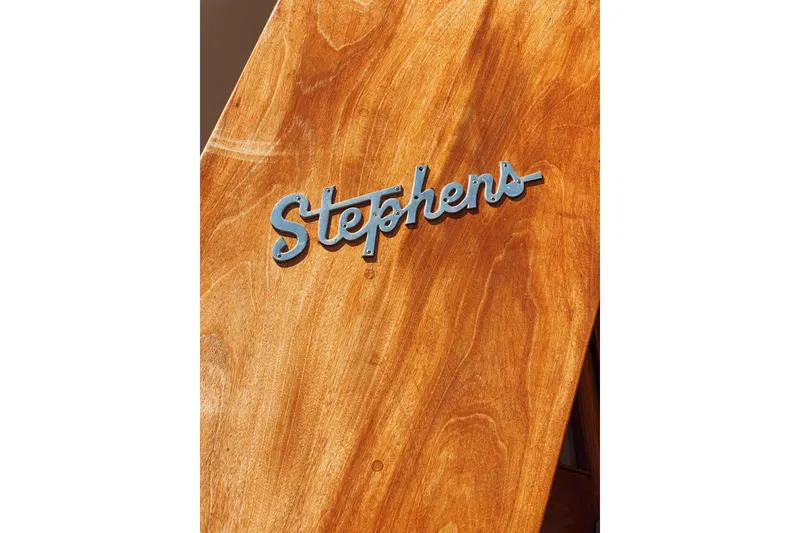 Slide: The Image of Stephens Brothers 1969 flush deck motor yacht wooden panel with logo. - 9