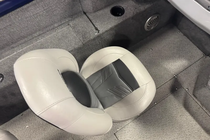 Slide: The Image of 2019 Tracker Pro Guide V-175 Combo boat interior with gray seating and carpeted flooring. - 10