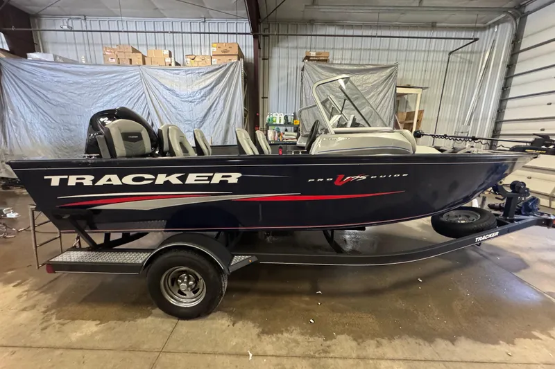 Slide: The Image of 2019 Tracker Pro Guide V-175 Combo boat in a garage setting. - 3