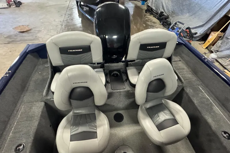 Slide: The Image of 2019 Tracker Pro Guide V-175 Combo boat interior with four gray seats. - 7