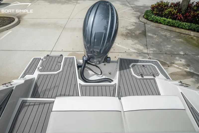 Slide: The Image of 2023 Starcraft SVX 231 OB DH boat with sleek deck and powerful outboard motor. - 9