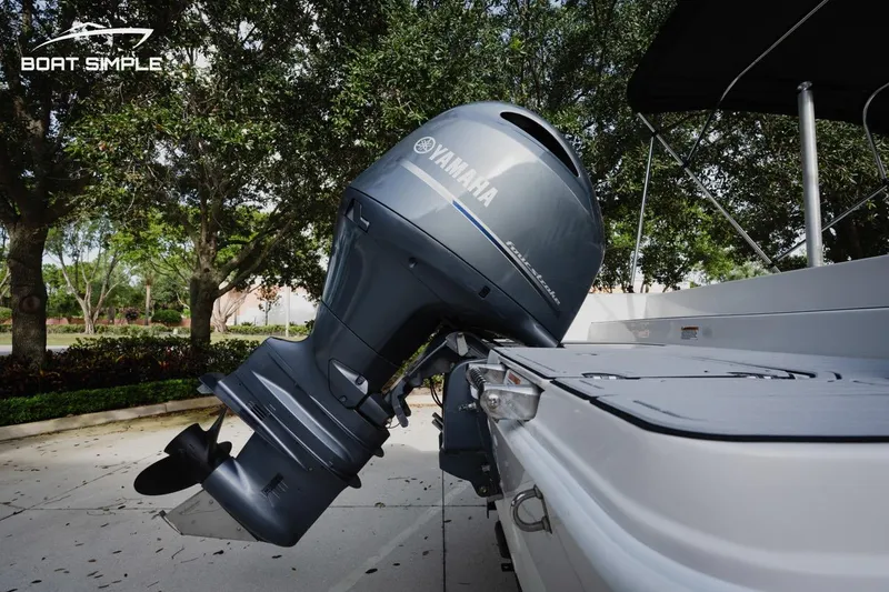 Slide: The Image of 2023 Starcraft SVX 211 OB boat with Yamaha outboard motor, parked outdoors. - 13