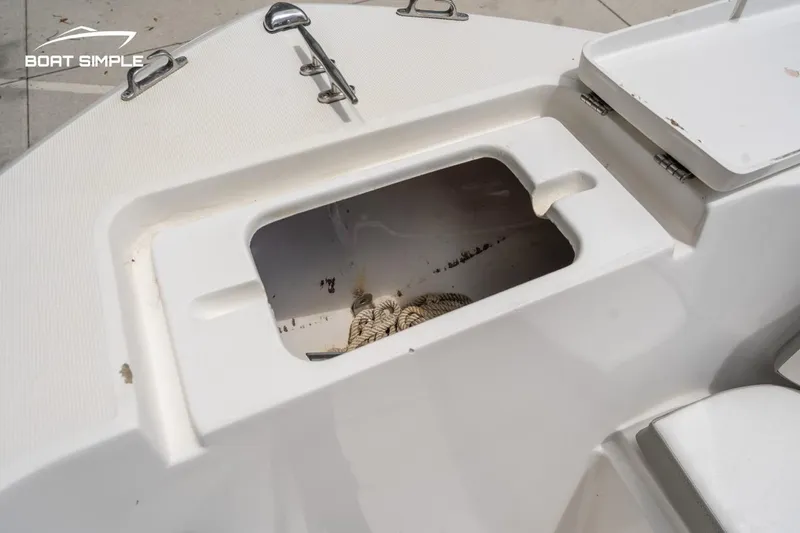 Slide: The Image of Open storage compartment on a 2020 Release 210 RX boat deck. - 15