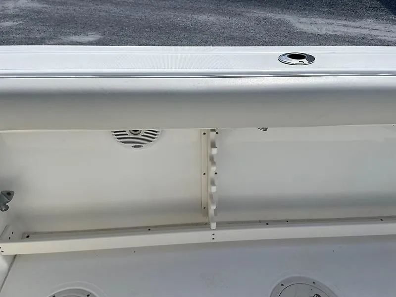 Slide: The Image of 2001 Shamrock 270 Open boat interior, featuring storage compartment and speaker. - 35