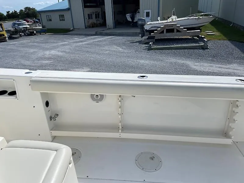 Slide: The Image of 2001 Shamrock 270 Open boat interior with storage compartments and seating. - 37