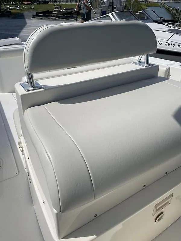 Slide: The Image of 2001 Shamrock 270 Open boat seat with white upholstery and sleek design. - 38
