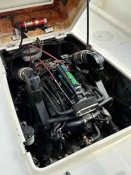 Slide: The Image of Engine compartment of a 2001 Shamrock 270 Open boat, showcasing detailed mechanics. - 42