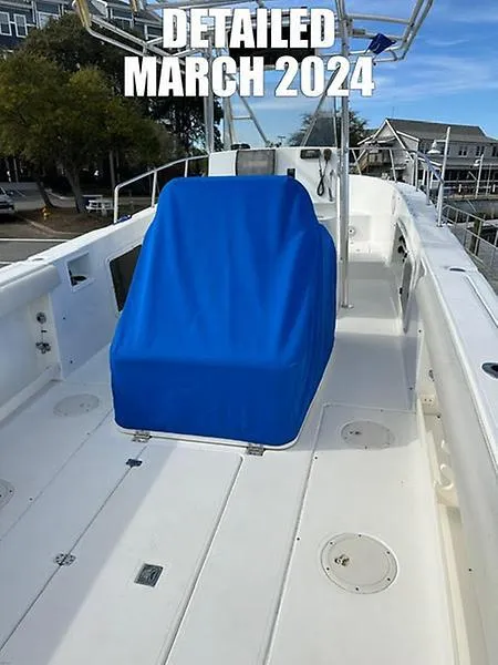 Slide: The Image of 2001 Shamrock 270 Open boat, detailed March 2024, with blue seat cover. - 6