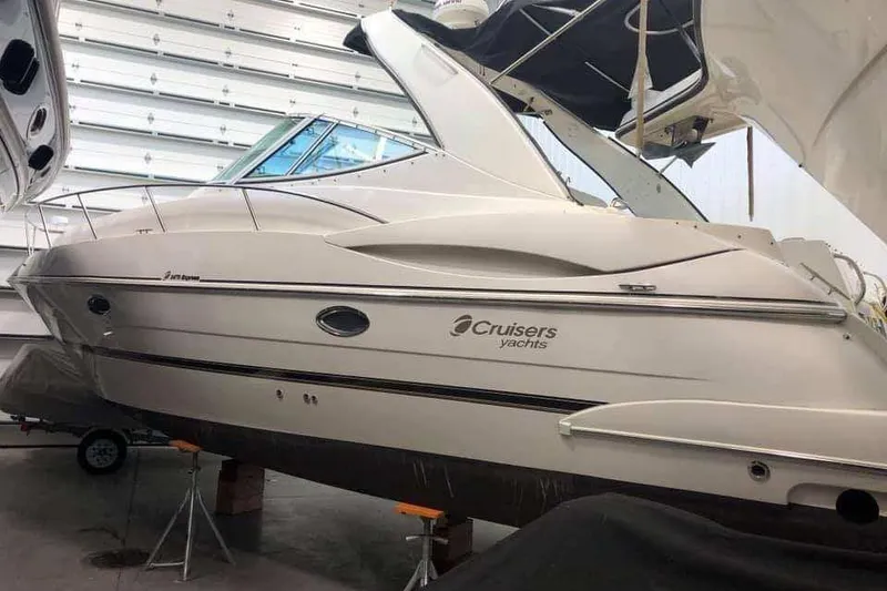 Slide: The Image of 2001 Cruisers Yachts 3470 Express in storage, side view. - 16