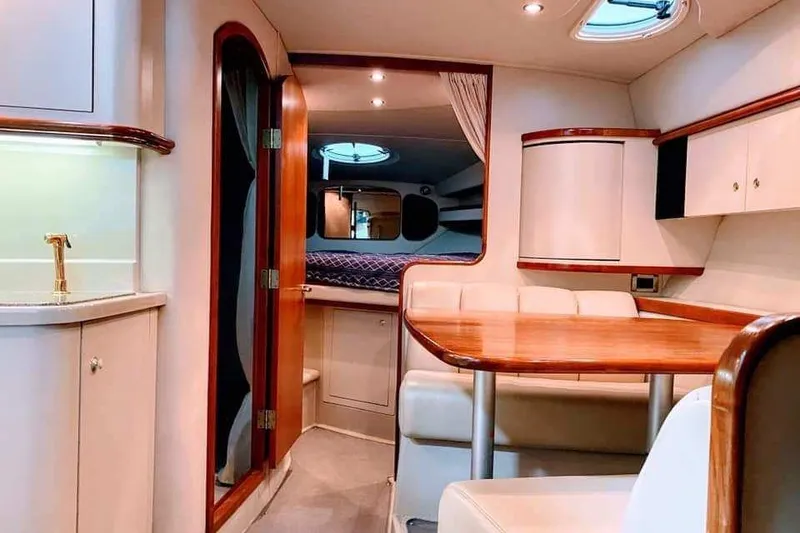 Slide: The Image of 2001 Cruisers Yachts 3470 Express in storage, side view. - 3