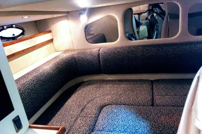 Slide: The Image of Luxurious cabin interior of 2001 Cruisers Yachts 3470 Express with cozy bedding. - 7