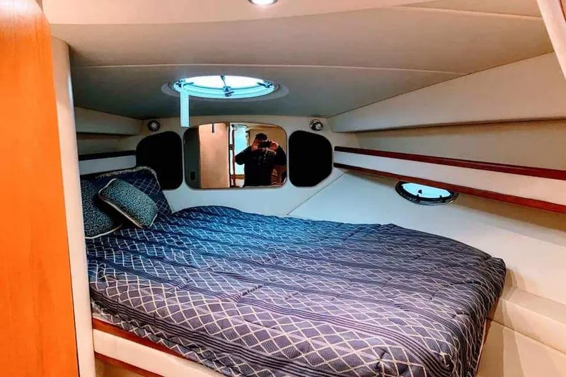 Slide: The Image of 2001 Cruisers Yachts 3470 Express interior with dining area and cozy seating. - 6