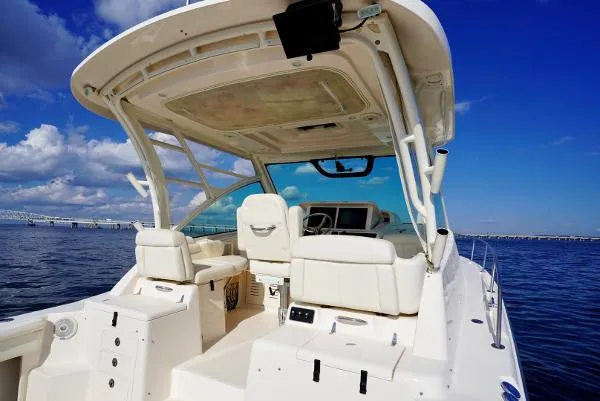 Slide: The Image of 2016 Grady-White Express 330 boat interior with helm, seating, and ocean view. - 16