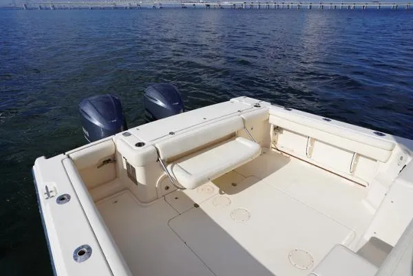 Slide: The Image of 2016 Grady-White Express 330 boat deck with seating and fishing equipment. - 20