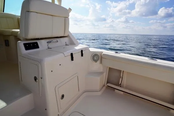 Slide: The Image of 2016 Grady-White Express 330 boat interior with ocean view and seating area. - 26