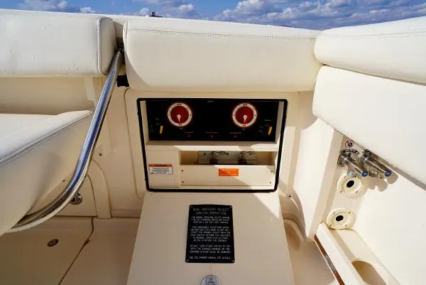 Slide: The Image of Control panel on 2016 Grady-White Express 330 boat, featuring gauges and switches. - 27