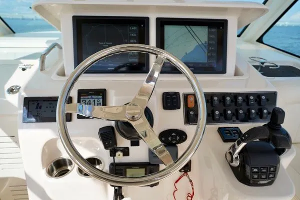 Slide: The Image of Helm of 2016 Grady-White Express 330 with dual displays and controls. - 31