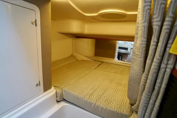 Slide: The Image of 2016 Grady-White Express 330 cabin interior with cozy sleeping area and modern design. - 42