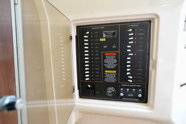 Slide: The Image of Electrical control panel on a 2016 Grady-White Express 330 boat. - 43