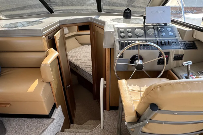Slide: The Image of 2001 Bayliner 4087 Aft Cabin Motoryacht interior with helm, seating, and cabin entrance. - 14