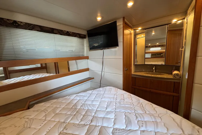 Slide: The Image of Luxurious cabin interior of 2001 Bayliner 4087 Aft Cabin Motoryacht with bed and vanity. - 22
