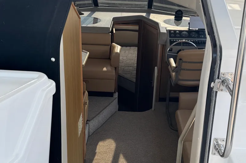 Slide: The Image of Interior view of 2001 Bayliner 4087 Aft Cabin Motoryacht, featuring helm and seating area. - 24