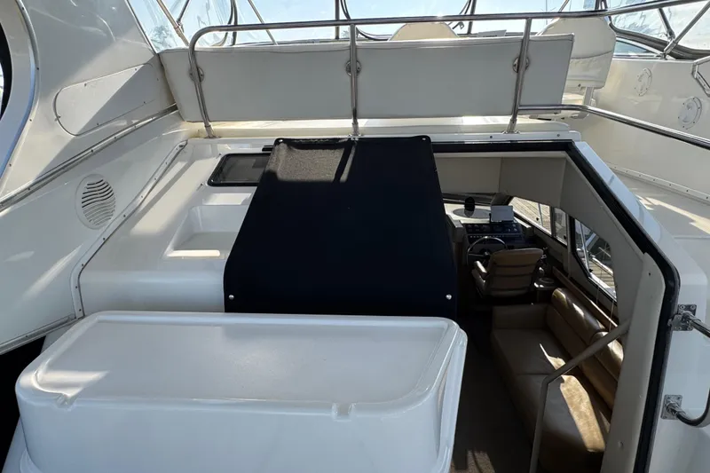 Slide: The Image of 2001 Bayliner 4087 Aft Cabin Motoryacht interior with helm and seating area. - 30