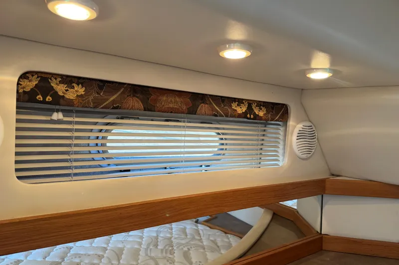 Slide: The Image of 2001 Bayliner 4087 Aft Cabin Motoryacht interior with window blinds and recessed lighting. - 31