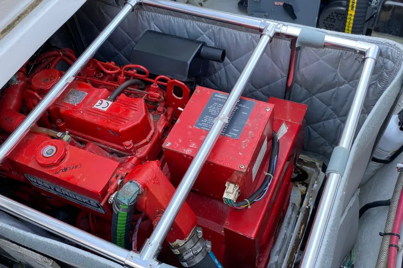 Slide: The Image of Engine compartment of 2001 Bayliner 4087 Aft Cabin Motoryacht with red machinery. - 39