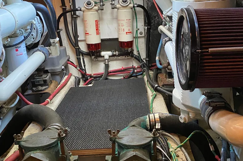 Slide: The Image of Engine room of 2001 Bayliner 4087 Aft Cabin Motoryacht with visible filters and hoses. - 41