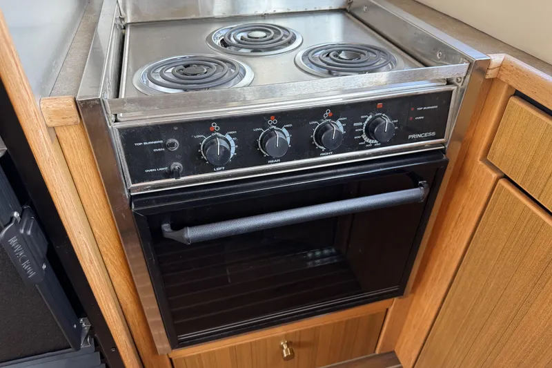 Slide: The Image of Stove and oven in 2001 Bayliner 4087 Aft Cabin Motoryacht kitchen. - 44