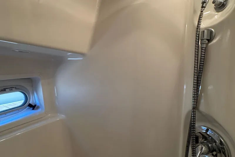 Slide: The Image of Interior shower of 2001 Bayliner 4087 Aft Cabin Motoryacht with window and chrome fixtures. - 48