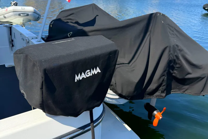 Slide: The Image of Bayliner 4087 Aft Cabin Motoryacht 2001 with covered Magma grill on deck. - 5