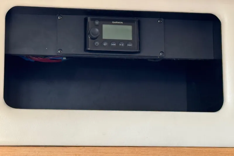 Slide: The Image of Control panel on 2001 Bayliner 4087 Aft Cabin Motoryacht with Garmin device. - 50