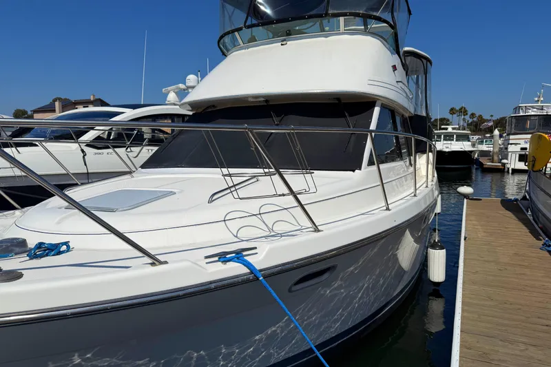 Slide: The Image of 2001 Bayliner 4087 Aft Cabin Motoryacht docked at marina under clear blue sky. - 53